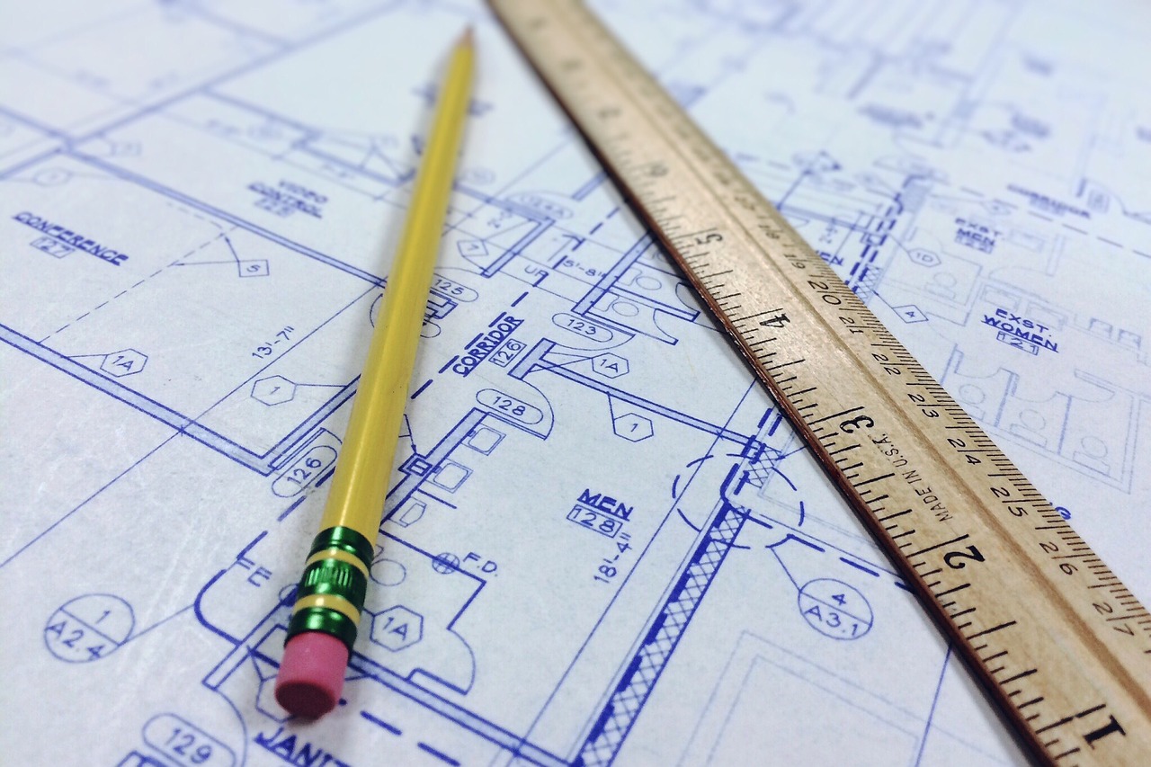 A blueprint, pencil and ruler