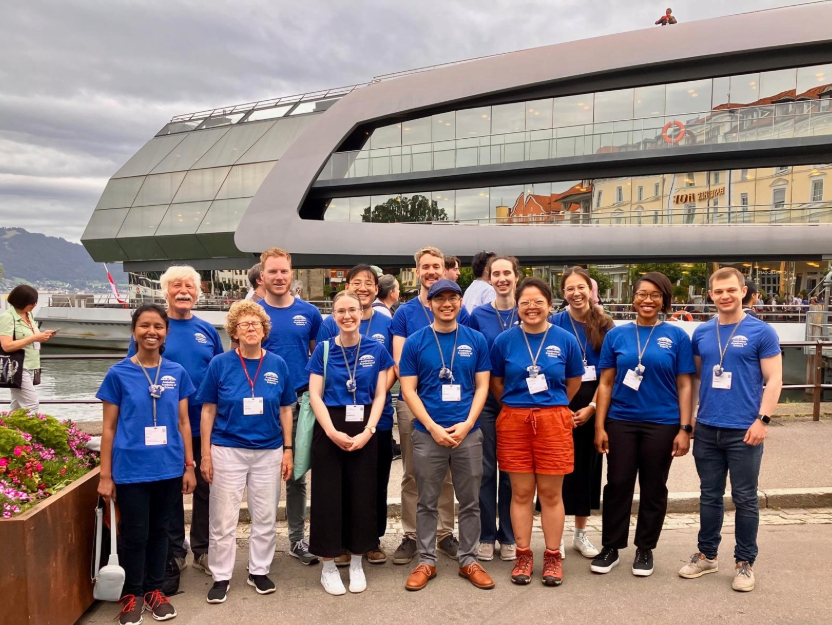 A group of people standing together in matching shirts