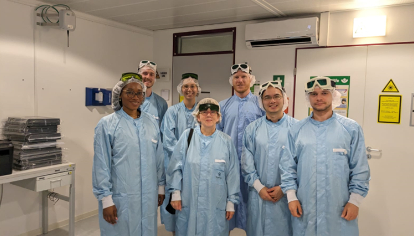 A group of people standing together in matching shirts