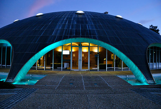 Shine Dome arches lit in blue at night