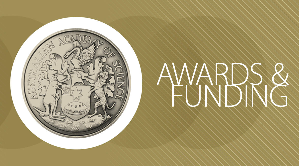 An academy medal on a gold background.