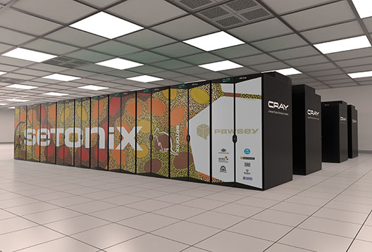 Rows of servers making up a supercomputer with orange and yellow artwork and the word 'Setonix' along the side