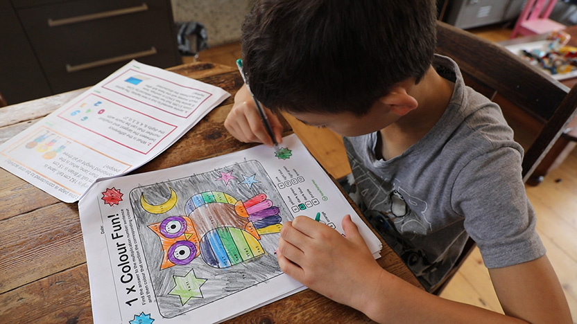 A boy working on a maths exercise