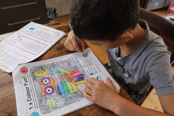 A boy working on a maths exercise