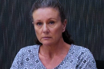 Ms Folbigg wearing a blue top and looking at the camera.